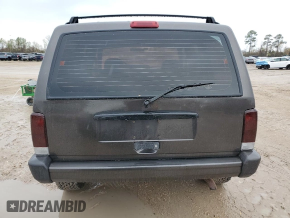 1999 Jeep Cherokee Sport with VIN 1J4FT68S2XL656679, listed as a Copart auction lot 88145875 with 254,038 mi miles and Salvage title. Bid and sale history available at DreamBid. Image 6.
