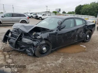 2019 Dodge Charger Police with VIN 2C3CDXKT1KH738538, listed as a Copart auction lot 59226025 with 105,806 mi miles and Salvage title. Bid and sale history available at DreamBid. Image 1.
