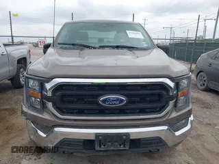 2023 Ford F-150 XL with VIN 1FTFW1E81PFB71702, listed as a IAAI auction lot 42102699 with 57,007 mi miles. Bid and sale history available at carsss.com. Image 12.