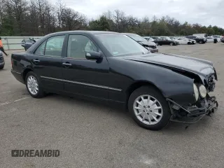 2001 Mercedes-Benz E-Class AWD with VIN WDBJF82J91X060969, listed as a Copart auction lot 71986544 with 113,694 mi miles and Salvage Title. Bid and sale history available at carsss.com. Image 4.