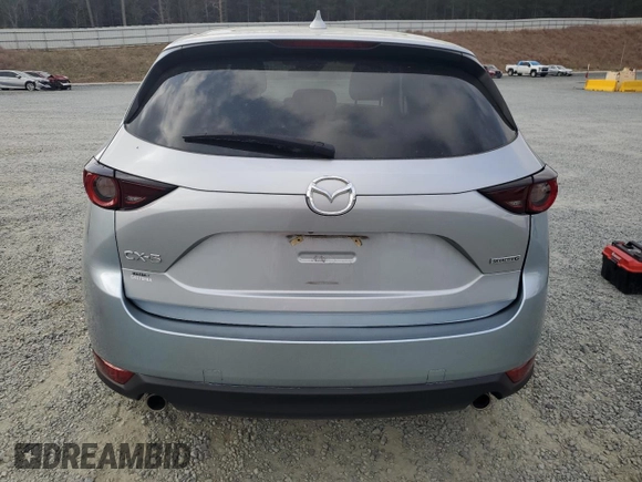 2021 Mazda CX-5 Touring with VIN JM3KFACM2M0451083, listed as a Copart auction lot 49999935 with 59,927 mi miles and Salvage Title. Bid and sale history available at carsss.com. Image 6.