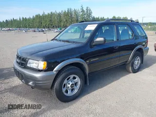 2001 Isuzu Rodeo S z VIN 4S2CK58W914361058, wystawiony jako IAAI lot #42404904 z przebiegiem 125 945 mil mil oraz . Historia ofert i sprzedaży dostępna na DreamBid. Obrazek 2.