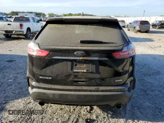 2020 Ford Edge SE z VIN 2FMPK3G91LBA42481, wystawiony jako Copart lot #50135885 z przebiegiem 104 656 mil mil oraz Nie do naprawy • Non repairable. Historia ofert i sprzedaży dostępna na DreamBid. Obrazek 6.