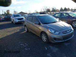 2013 Hyundai Accent GS with VIN KMHCT5AE8DU126970, listed as a IAAI auction lot 40906867 with 142,484 mi miles and . Bid and sale history available at DreamBid. Image 1.