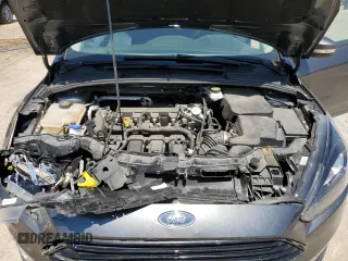 2018 Ford Focus SE z VIN 1FADP3F20JL257320, wystawiony jako Copart lot #55956435 z przebiegiem 26 919 mil mil oraz Szkoda całkowita • Salvage title. Historia ofert i sprzedaży dostępna na DreamBid. Obrazek 11.