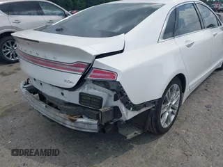 2014 Lincoln MKZ Hybrid z VIN 3LN6L2LU2ER825732, wystawiony jako IAAI lot #42606357 z przebiegiem 153 966 mil mil oraz . Historia ofert i sprzedaży dostępna na DreamBid. Obrazek 16.