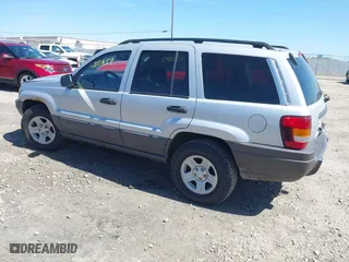 2002 Jeep Grand Cherokee Laredo with VIN 1J4GW48S42C324297, listed as a IAAI auction lot 42050957 with 135,542 mi miles. Bid and sale history available at carsss.com. Image 3.