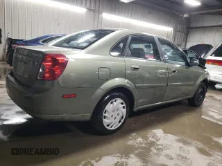 2004 Suzuki Forenza S z VIN KL5JD52Z14K975804, wystawiony jako Copart lot #43227455 z przebiegiem 114 726 mil mil oraz Szkody całkowita. Historia ofert i sprzedaży dostępna na DreamBid. Obrazek 3.