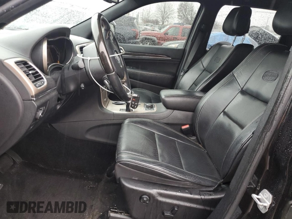 2015 Jeep Grand Cherokee Overland with VIN 1C4RJFCG7FC925995, listed as a Copart auction lot 85421214 with 142,266 mi miles and Salvage Title. Bid and sale history available at carsss.com. Image 7.