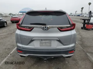2020 Honda CR-V Touring z VIN 7FARW1H96LE006653, wystawiony jako Copart lot #57167475 z przebiegiem 49 286 mil mil oraz Szkoda całkowita • Salvage title. Historia ofert i sprzedaży dostępna na DreamBid. Obrazek 6.