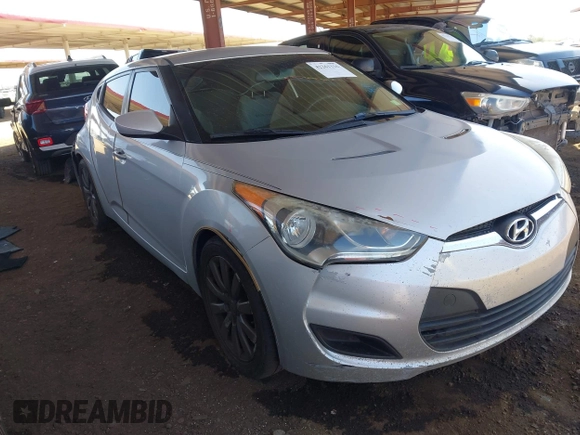 2012 Hyundai Veloster w/Black Int z VIN KMHTC6AD2CU052067, wystawiony jako IAAI lot #42261316 z przebiegiem 187 234 mil mil oraz . Historia ofert i sprzedaży dostępna na DreamBid. Obrazek 1.