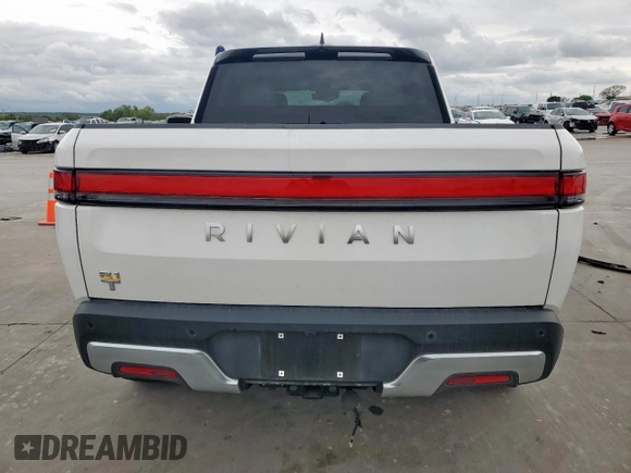 2022 Rivian R1T Adventure z VIN 7FCTGAAA8NN013508, wystawiony jako Copart lot #50834485 z przebiegiem Nie podano mil oraz Szkody całkowita. Historia ofert i sprzedaży dostępna na DreamBid. Obrazek 6.