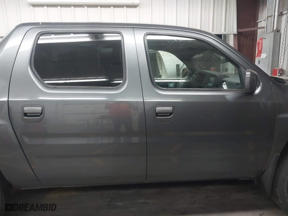2011 Honda Ridgeline RTL with VIN 5FPYK1F57BB004189, listed as a IAAI auction lot 41871741 with 193,913 mi miles. Bid and sale history available at carsss.com. Image 13.
