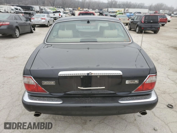 1999 Jaguar XJ z VIN SAJKD6043XC872105, wystawiony jako Copart lot #86270724 z przebiegiem Nie podano mil oraz Szkoda całkowita • Salvage title. Historia ofert i sprzedaży dostępna na DreamBid. Obrazek 6.