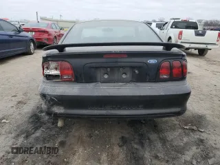 1997 Ford Mustang with VIN 1FALP4042VF198111, listed as a Copart auction lot 44245505 with 99,501 mi miles and Salvage Title. Bid and sale history available at carsss.com. Image 6.