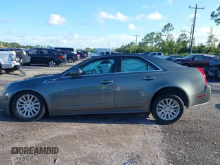2011 Cadillac CTS Luxury with VIN 1G6DE5EY5B0154563, listed as a IAAI auction lot 36806985 with 92,635 mi miles and . Bid and sale history available at DreamBid. Image 14.