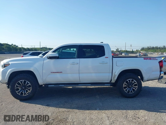 2018 Toyota Tacoma SR with VIN 5TFAX5GN2JX128621, listed as a IAAI auction lot 41797514 with 216,251 mi miles and . Bid and sale history available at DreamBid. Image 14.