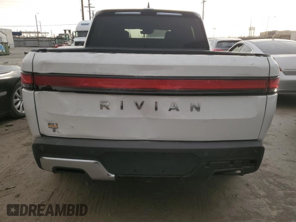 2022 Rivian R1T Adventure z VIN 7FCTGAAA9NN014280, wystawiony jako Copart lot #87908175 z przebiegiem 28 601 mil mil oraz Szkody całkowita. Historia ofert i sprzedaży dostępna na DreamBid. Obrazek 6.