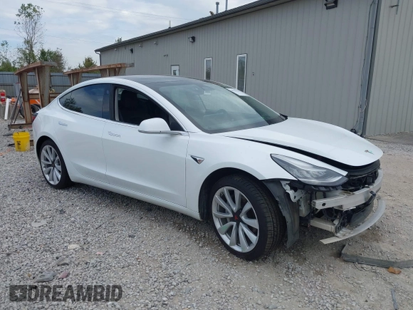 2019 Tesla Model 3 Mid Range z VIN 5YJ3E1EA5KF466517, wystawiony jako IAAI lot #40296116 z przebiegiem 66 509 mil mil oraz . Historia ofert i sprzedaży dostępna na DreamBid. Obrazek 1.