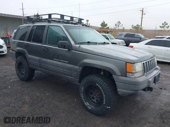 1997 Jeep Grand Cherokee Laredo with VIN 1J4GZ58Y8VC624804, listed as a IAAI auction lot 41736324 with 165,851 mi miles. Bid and sale history available at carsss.com. Image 1.