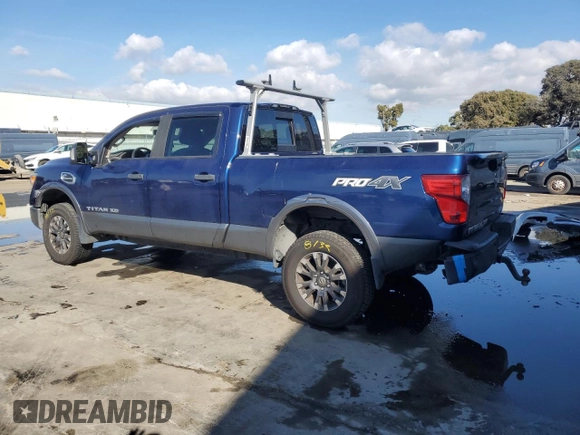 2016 Nissan Titan XD PRO-4X with VIN 1N6BA1F42GN509751, listed as a Copart auction lot 80576664 with 79,037 mi miles and Salvage Title. Bid and sale history available at carsss.com. Image 2.
