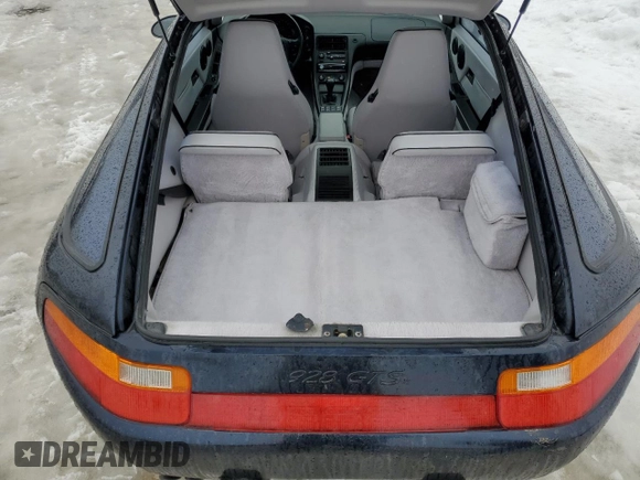 1993 Porsche 928 z VIN WP0AA2929PS815135, wystawiony jako Copart lot #86840514 z przebiegiem 69 263 mil mil oraz Szkody całkowita. Historia ofert i sprzedaży dostępna na DreamBid. Obrazek 12.