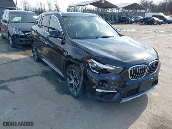 2019 BMW X1 xDrive28i with VIN WBXHT3C51K5L89758, listed as a IAAI auction lot 41535652 with 96,612 mi miles. Bid and sale history available at carsss.com. Image 1.