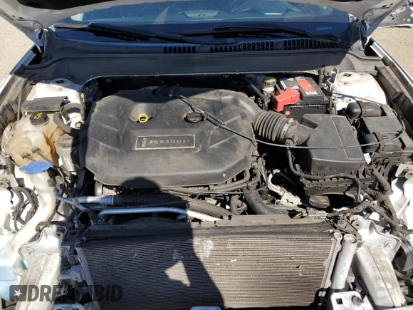 2016 Lincoln MKZ z VIN 3LN6L2G90GR600752, wystawiony jako Copart lot #56599625 z przebiegiem 73 275 mil mil oraz Szkoda całkowita • Salvage title. Historia ofert i sprzedaży dostępna na DreamBid. Obrazek 11.