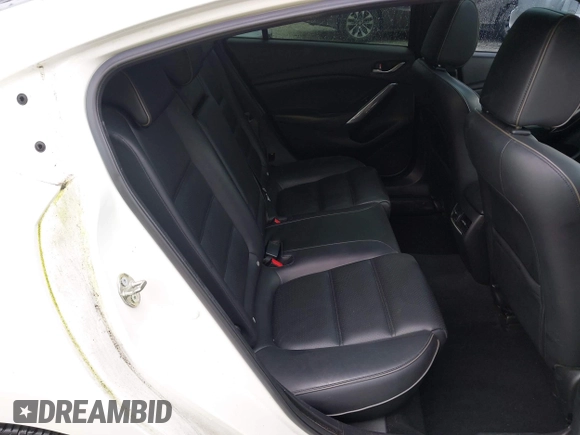 2017 Mazda 6 Grand Touring with VIN JM1GL1X51H1142473, listed as a IAAI auction lot 42234809 with 101,633 mi miles and . Bid and sale history available at DreamBid. Image 8.