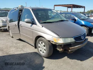 2003 Honda Odyssey EX-L z VIN 5FNRL180X3B033974, wystawiony jako IAAI lot #42001826 z przebiegiem 231 207 mil mil oraz . Historia ofert i sprzedaży dostępna na DreamBid. Obrazek 1.