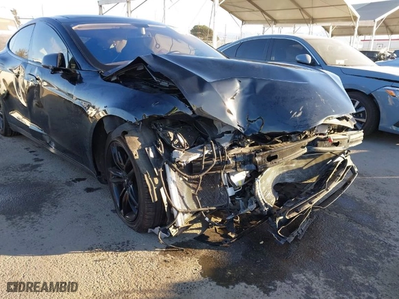 2013 Tesla Model S with VIN 5YJSA1AC3DFP10599, listed as a IAAI auction lot 40869838 with 99,047 mi miles. Bid and sale history available at carsss.com. Image 6.