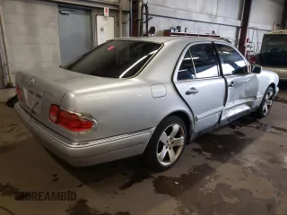 1999 Mercedes-Benz E-Class with VIN WDBJF82H4XX021888, listed as a Copart auction lot 83069274 with 173,198 mi miles and Salvage Title. Bid and sale history available at carsss.com. Image 3.