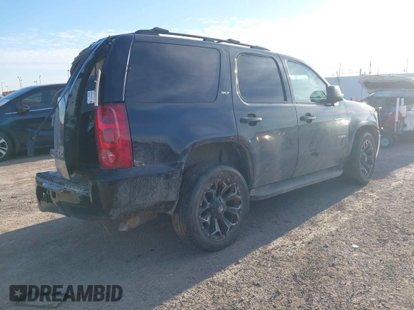 2014 GMC Yukon SLT with VIN 1GKS1CE00ER247249, listed as a IAAI auction lot 41271351 with 215,044 mi miles. Bid and sale history available at carsss.com. Image 4.