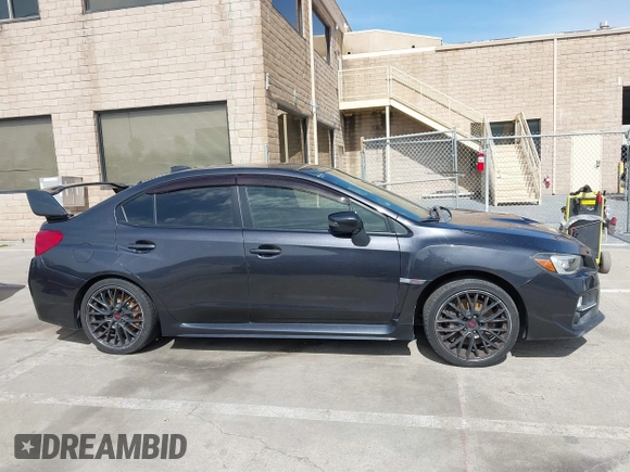 2015 Subaru WRX STI z VIN JF1VA2P68F9823116, wystawiony jako IAAI lot #41842139 z przebiegiem 95 710 mil mil oraz . Historia ofert i sprzedaży dostępna na DreamBid. Obrazek 14.