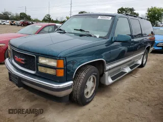 1996 GMC Suburban z VIN 1GKEC16R2TJ714191, wystawiony jako Copart lot #74660264 z przebiegiem 186 801 mil mil oraz Szkody całkowita. Historia ofert i sprzedaży dostępna na DreamBid. Obrazek 1.