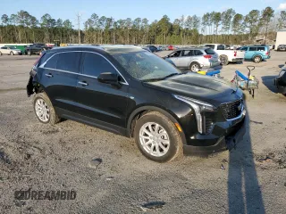 2023 Cadillac XT4 FWD Luxury with VIN 1GYAZAR49PF102307, listed as a Copart auction lot 49342465 with 21,093 mi miles and Salvage Title. Bid and sale history available at DreamBid. Image 4.