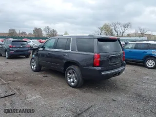 2015 Chevrolet Tahoe LTZ with VIN 1GNSKCKC2FR107428, listed as a IAAI auction lot 41911940 with 148,668 mi miles. Bid and sale history available at carsss.com. Image 3.