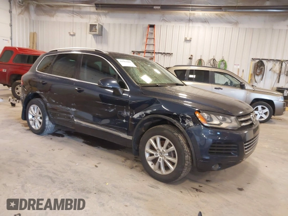 2014 Volkswagen Touareg Sport with VIN WVGEF9BP9ED008967, listed as a IAAI auction lot 41984409 with 193,859 mi miles and . Bid and sale history available at DreamBid. Image 1.