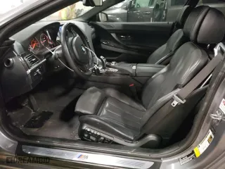 2012 BMW 6 Series 650i xDrive with VIN WBALX5C56CC894132, listed as a Copart auction lot 82968294 with 76,599 mi miles and Clean Title. Bid and sale history available at carsss.com. Image 7.