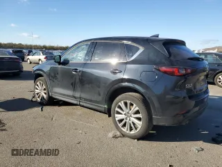2023 Mazda CX-5 Signature with VIN JM3KFBXYXP0130139, listed as a Copart auction lot 88321445 with 22,911 mi miles and Salvage Title. Bid and sale history available at carsss.com. Image 2.