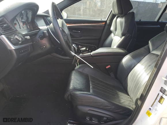 2014 BMW M5 with VIN WBSFV9C56ED097642, listed as a Copart auction lot 77905514 with 77,022 mi miles and Salvage Title. Bid and sale history available at carsss.com. Image 7.