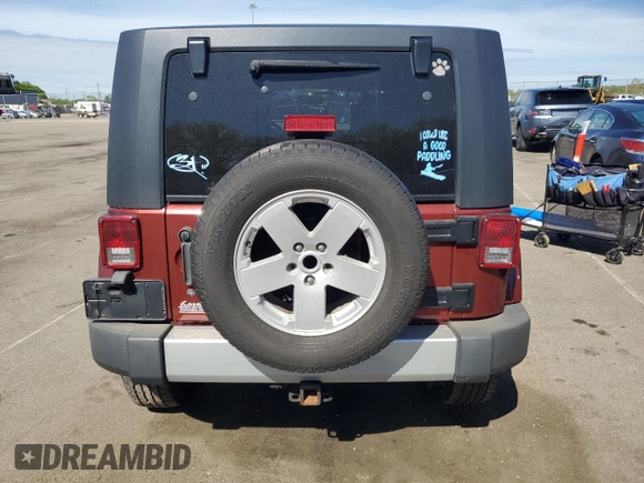 2008 Jeep Wrangler Unlimited Sahara with VIN 1J4GA59168L534967, listed as a Copart auction lot 54894635 with 180,581 mi miles and Salvage title. Bid and sale history available at DreamBid. Image 6.