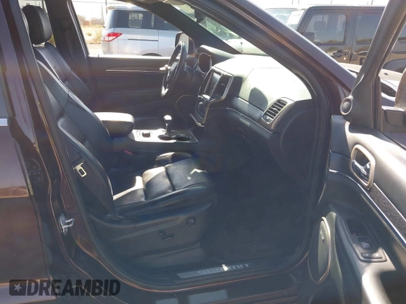 2015 Jeep Grand Cherokee Summit with VIN 1C4RJFJGXFC125131, listed as a IAAI auction lot 42475017 with 128,166 mi miles and . Bid and sale history available at DreamBid. Image 5.