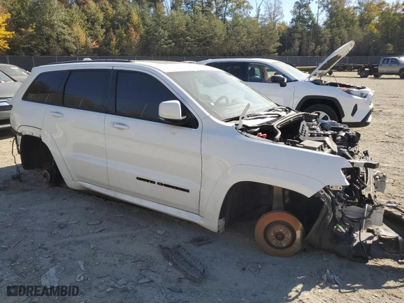 2021 Jeep Grand Cherokee SRT with VIN 1C4RJFDJ5MC584989, listed as a Copart auction lot 71048734 with 68,774 mi miles and Salvage Title. Bid and sale history available at carsss.com. Image 4.