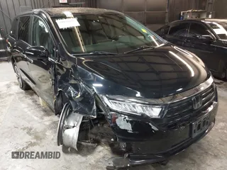 2021 Honda Odyssey Touring with VIN 5FNRL6H83MB040138, listed as a IAAI auction lot 39150096 with 61,322 mi miles and . Bid and sale history available at DreamBid. Image 1.