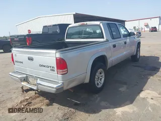 2003 Dodge Dakota SLT with VIN 1D7HL48N83S236590, listed as a IAAI auction lot 41796103 with 221,667 mi miles. Bid and sale history available at carsss.com. Image 4.