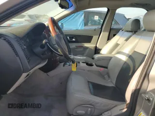 2006 Cadillac CTS with VIN 1G6DM57T860124659, listed as a Copart auction lot 57287985 with 141,162 mi miles and Salvage title. Bid and sale history available at DreamBid. Image 7.