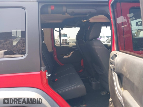 2014 Jeep Wrangler Unlimited Rubicon with VIN 1C4BJWFG0EL326979, listed as a IAAI auction lot 41913129 with 118,548 mi miles and . Bid and sale history available at DreamBid. Image 8.