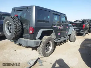 2013 Jeep Wrangler Unlimited Sport with VIN 1C4BJWDG9DL569109, listed as a IAAI auction lot 41207715 with 120,800 mi miles. Bid and sale history available at carsss.com. Image 4.