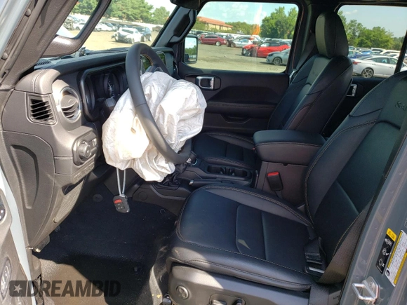 2024 Jeep Wrangler Sahara with VIN 1C4PJXEGXRW269062, listed as a Copart auction lot 64576895 with 2,159 mi miles and Salvage title. Bid and sale history available at DreamBid. Image 7.